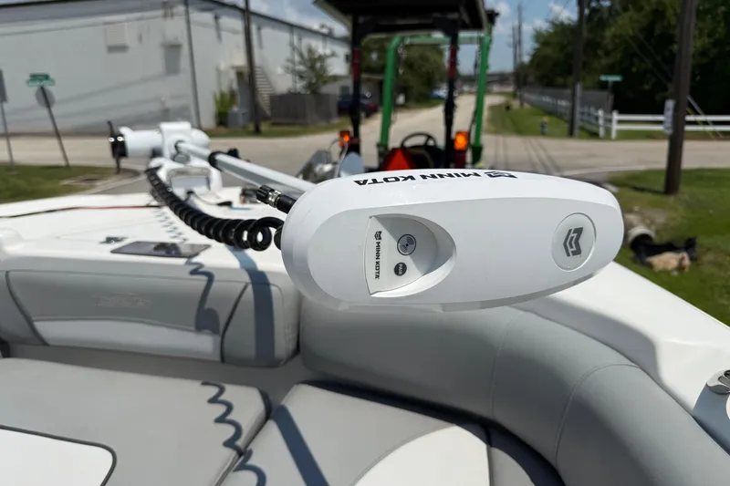 Slide: The Image of 2022 NauticStar 251 Hybrid boat with Minn Kota trolling motor on deck. - 20