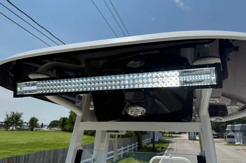 Slide: The Image of 2022 NauticStar 251 Hybrid boat with LED light bar on T-top. - 22