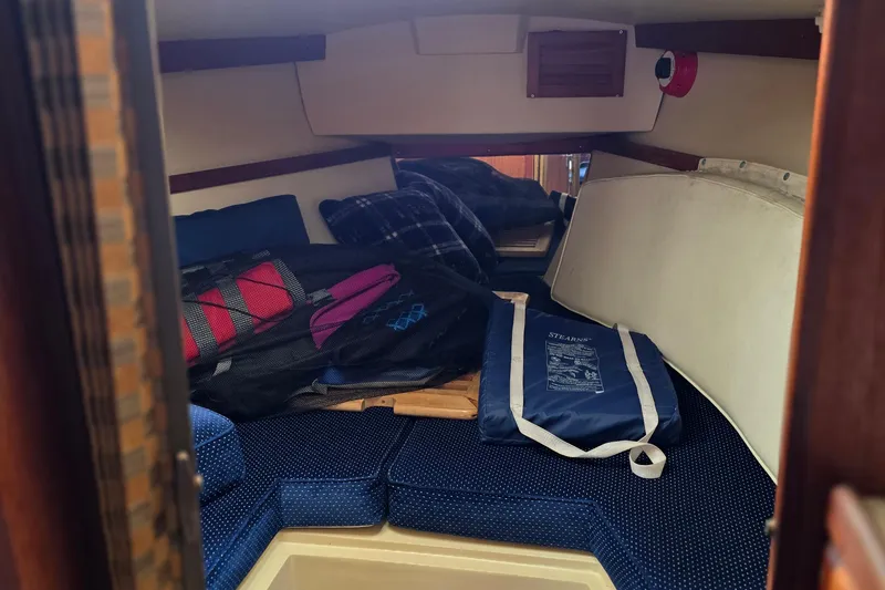 Slide: The Image of Interior cabin of a 1987 Catalina 30 MkII sailboat with cushions and gear. - 13