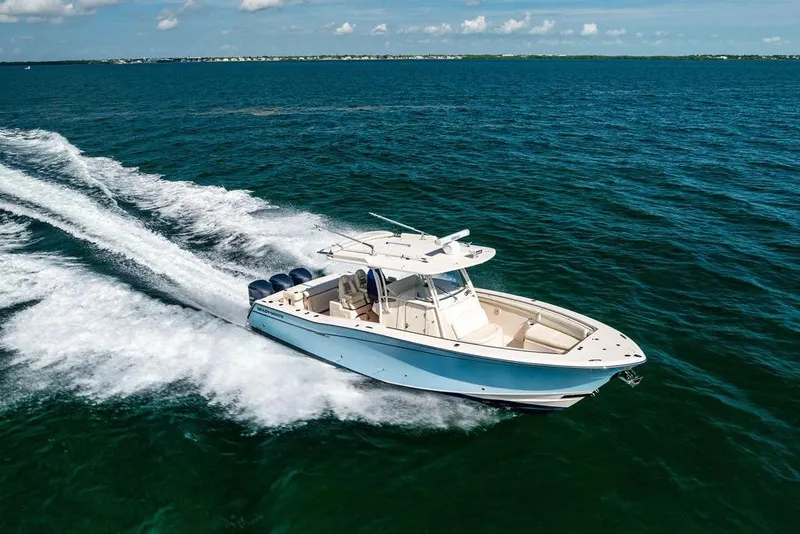 The Image of 2016 Grady-White Canyon 336 boat cruising on open ocean waters. - 0