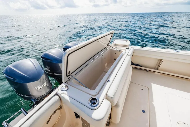 Slide: The Image of 2016 Grady-White Canyon 336 boat with open storage, twin Yamaha 300 engines, ocean view. - 11