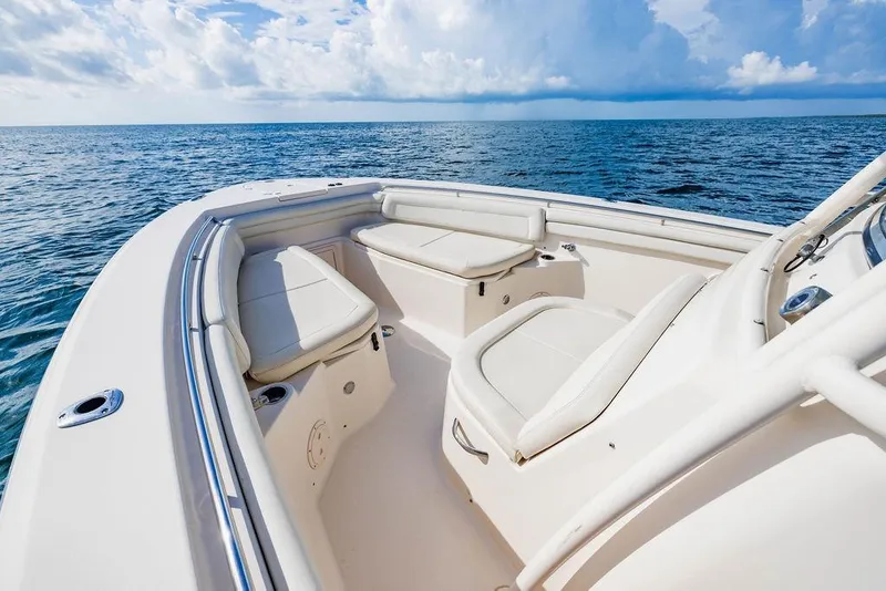 Slide: The Image of 2016 Grady-White Canyon 336 boat interior with ocean view and seating area. - 14
