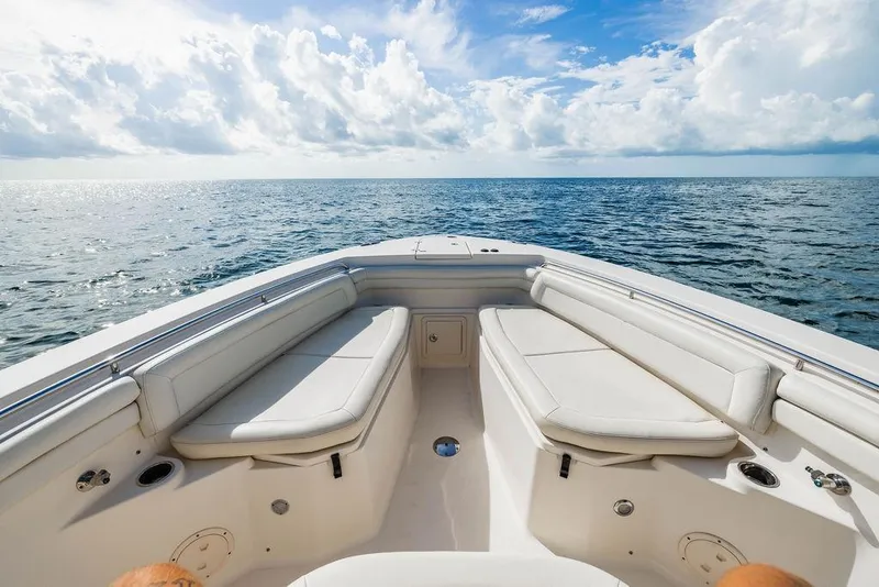 Slide: The Image of 2016 Grady-White Canyon 336 boat on open sea under blue sky. - 15