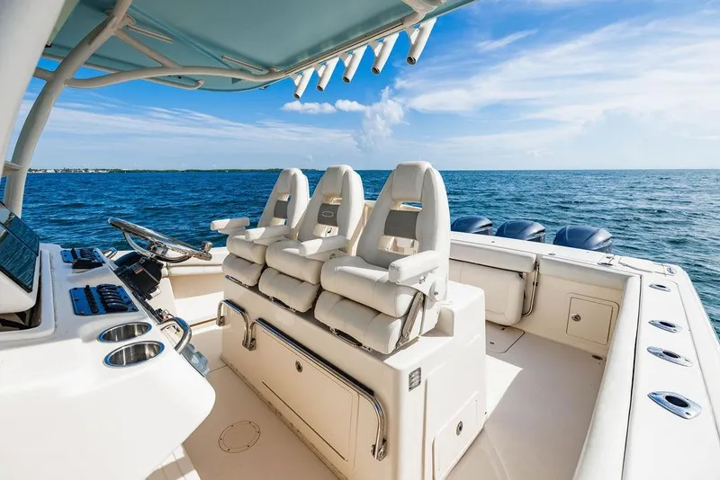 Slide: The Image of 2016 Grady-White Canyon 336 boat interior with ocean view and seating. - 16
