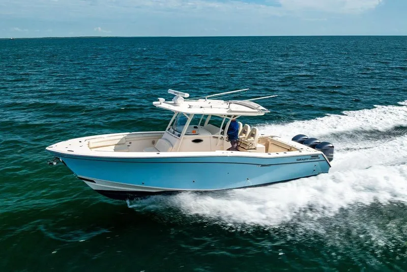 Slide: The Image of 2016 Grady-White Canyon 336 boat cruising on open water. - 2