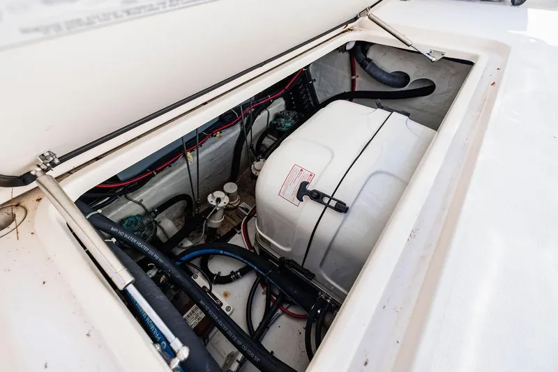 Slide: The Image of 2016 Grady-White Canyon 336 boat engine compartment with visible wiring and components. - 21