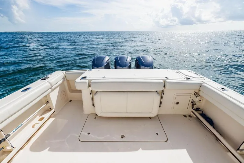Slide: The Image of 2016 Grady-White Canyon 336 boat deck with ocean view and triple engines. - 5