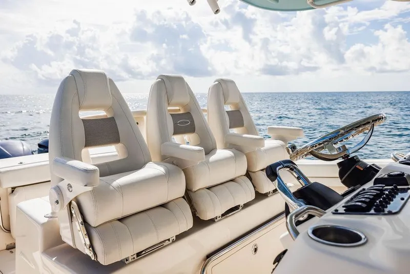 Slide: The Image of 2016 Grady-White Canyon 336 boat interior with luxurious seating and ocean view. - 8
