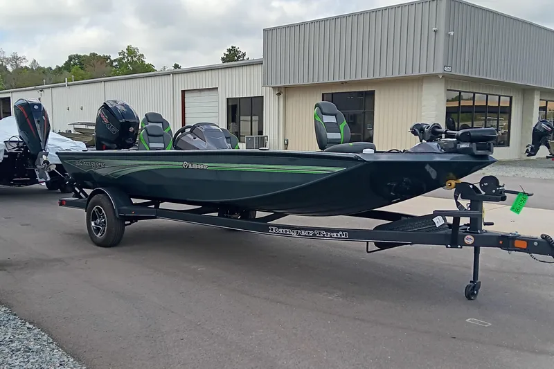 Slide: The Image of 2025 Ranger RT188P boat on trailer, parked outside a building. - 2