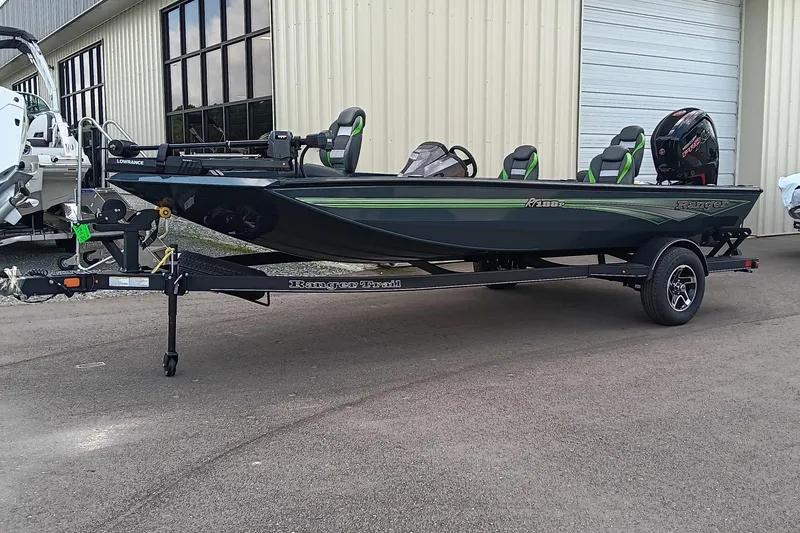 Slide: The Image of 2025 Ranger RT188P fishing boat on trailer, parked outside a building. - 3