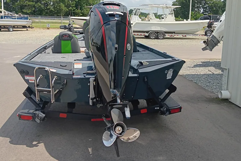 Slide: The Image of 2025 Ranger RT188P boat with Mercury engine, parked outdoors, rear view. - 7
