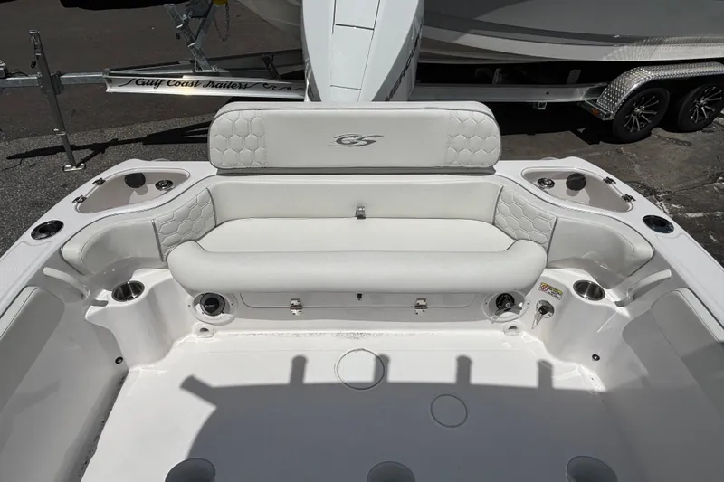 Slide: The Image of 2025 Glasstream 240 CCX boat interior with white seating and cup holders. - 12