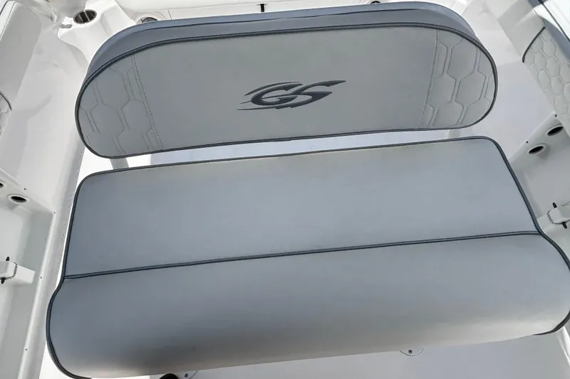 Slide: The Image of 2025 Glasstream 240 CCX boat seat with logo, featuring sleek gray upholstery. - 14