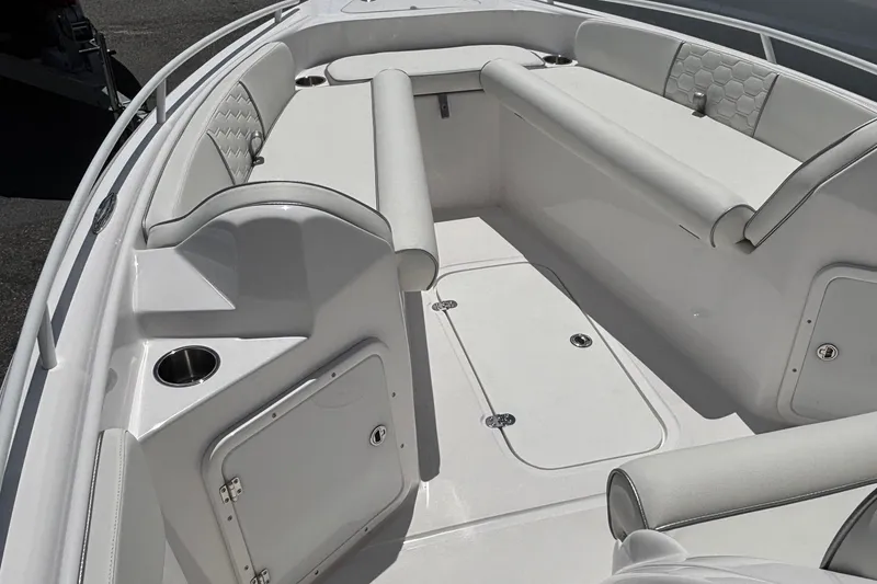 Slide: The Image of 2025 Glasstream 240 CCX boat interior with white seating and storage compartments. - 7