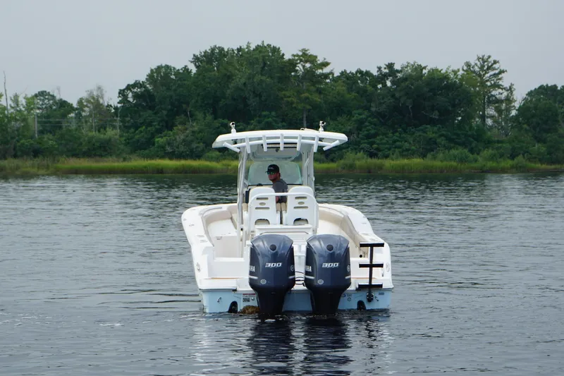 Slide: The Image of 2016 Sea Fox 286 boat with dual engines on a calm lake. - 22