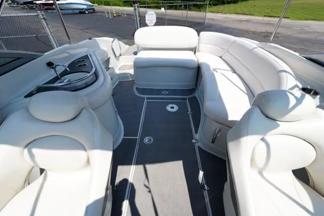 Slide: The Image of 2006 Crownline 252 EX boat interior with white seating and sleek design. - 15