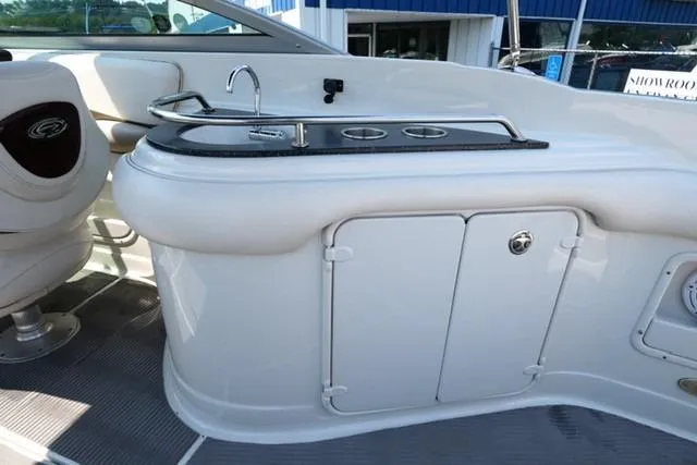 Slide: The Image of 2006 Crownline 252 EX boat interior with sink and storage area. - 16