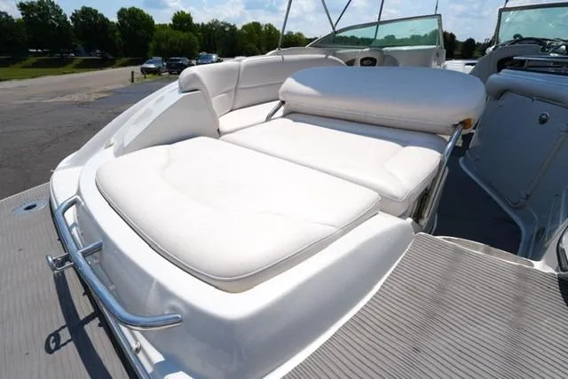 Slide: The Image of 2006 Crownline 252 EX boat with spacious white sunbathing deck and seating area. - 17