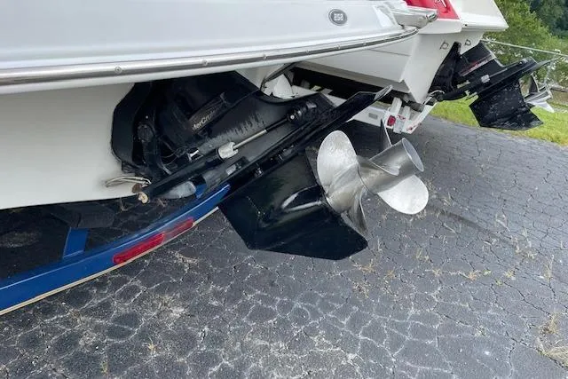 Slide: The Image of 2006 Crownline 252 EX boat with dual propellers on a trailer. - 18