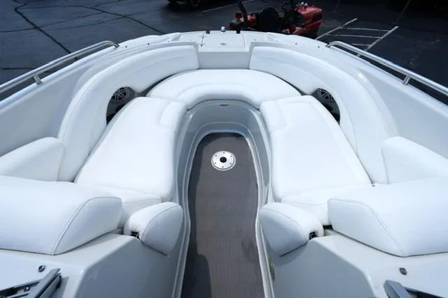 Slide: The Image of 2006 Crownline 252 EX boat interior with white seating and gray flooring. - 7