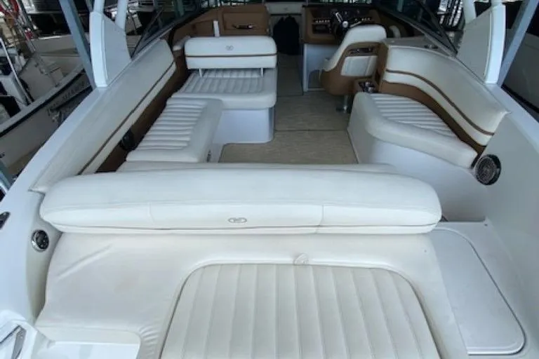 Slide: The Image of 2015 Cobalt R7 boat interior with white leather seating and brown accents. - 4