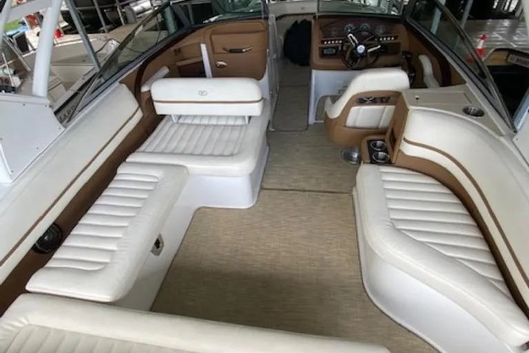 Slide: The Image of Interior of a 2015 Cobalt R7 boat with white and brown seating. - 5