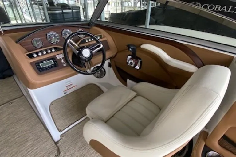 Slide: The Image of Luxurious 2015 Cobalt R7 boat interior with leather seating and modern dashboard controls. - 6