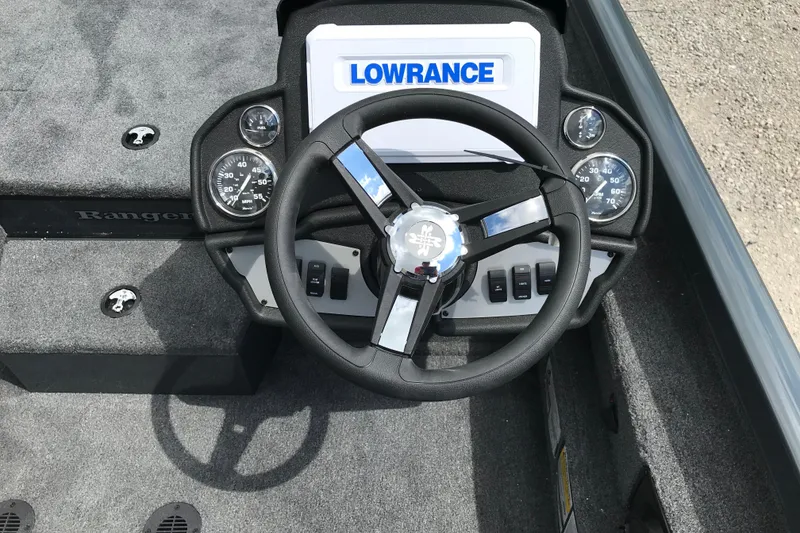 Slide: The Image of 2026 Ranger RT198P boat interior with steering wheel and Lowrance electronics. - 13