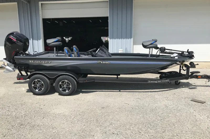 Slide: The Image of 2026 Ranger RT198P fishing boat on trailer, parked outside a building. - 5