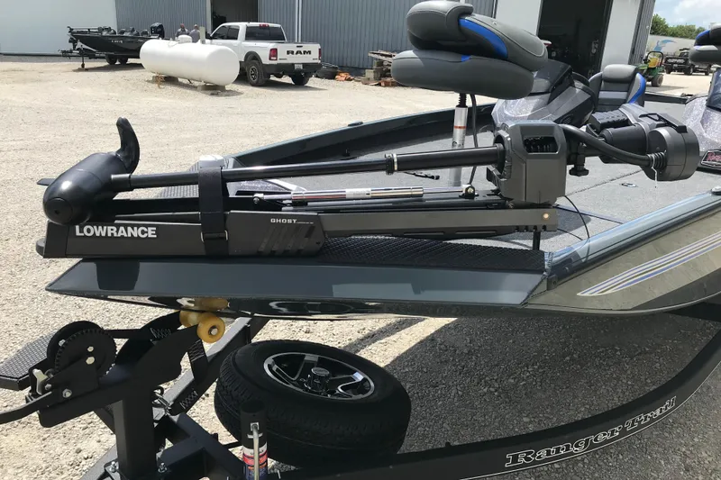 Slide: The Image of 2026 Ranger RT198P boat with Mercury Pro XS outboard motor in a gravel lot. - 9