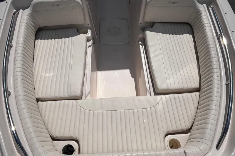 Slide: The Image of 2006 Grady-White Tournament 225 boat interior with cushioned seating and sleek design. - 10