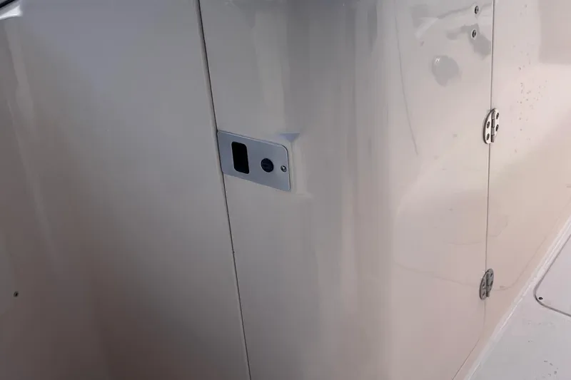 Slide: The Image of 2006 Grady-White Tournament 225 boat interior detail with latch and hinges. - 13