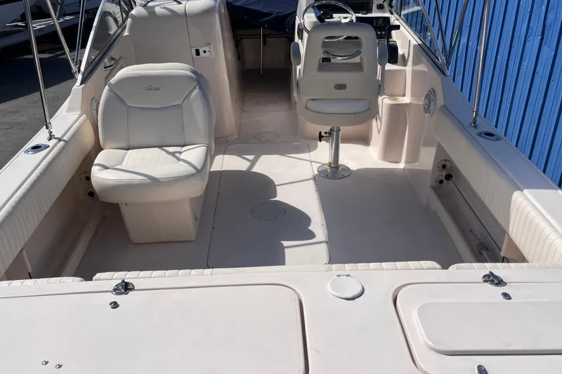 Slide: The Image of 2006 Grady-White Tournament 225 boat interior with seating and steering console. - 15