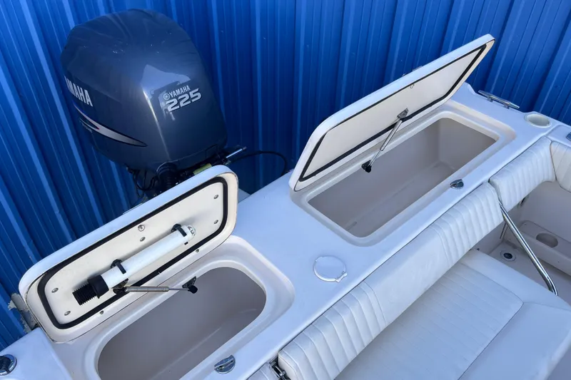 Slide: The Image of 2006 Grady-White Tournament 225 boat with Yamaha 225 engine and open storage compartments. - 22