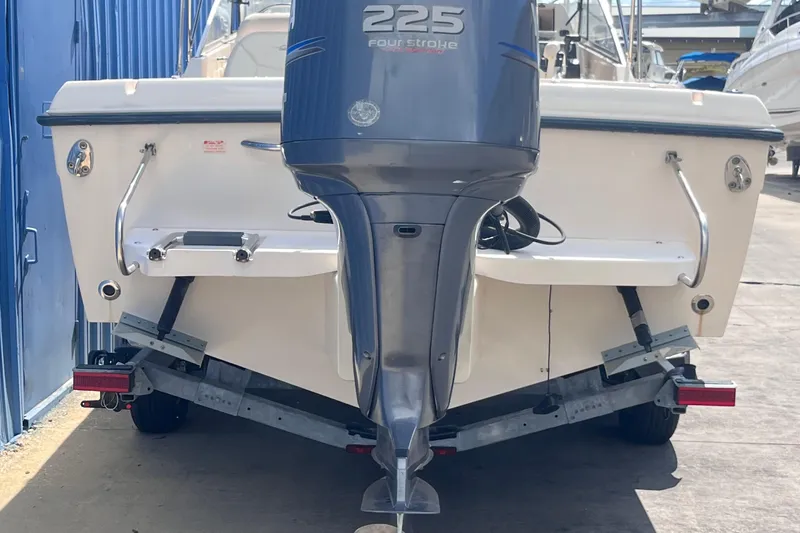 Slide: The Image of 2006 Grady-White Tournament 225 boat with outboard motor on trailer. - 5