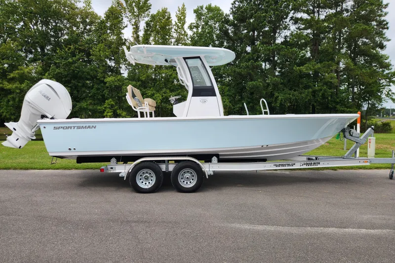 The Image of 2026 Sportsman Masters 247 Bay Boat on trailer, side view, outdoors. - 0