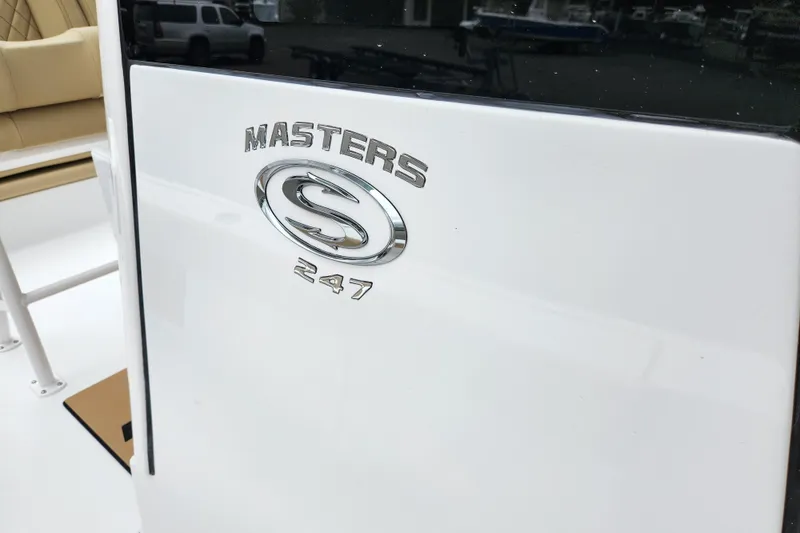 Slide: The Image of 2026 Sportsman Masters 247 Bay Boat logo on white surface. - 11