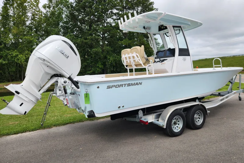 Slide: The Image of 2026 Sportsman Masters 247 Bay Boat on trailer with Yamaha outboard motor. - 2