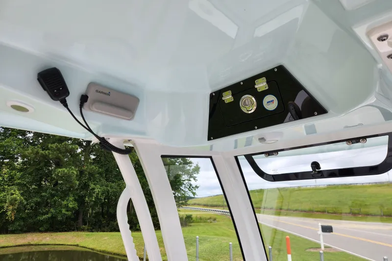 Slide: The Image of 2026 Sportsman Masters 247 Bay Boat interior with Garmin device and control panel. - 21