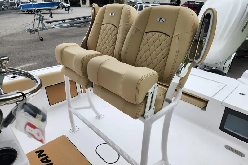 Slide: The Image of 2026 Sportsman Masters 247 Bay Boat with tan leather seats and sleek design. - 25