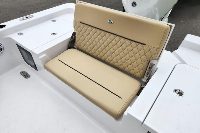 Slide: The Image of 2026 Sportsman Masters 247 Bay Boat with tan quilted seating and white deck. - 28