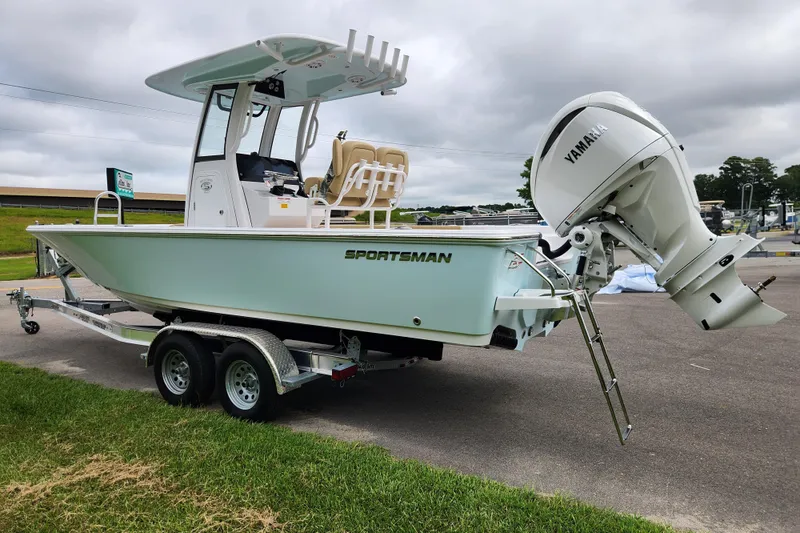 Slide: The Image of 2026 Sportsman Masters 247 Bay Boat with Yamaha engine on trailer, parked outdoors. - 5