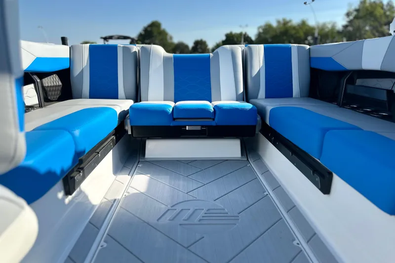 Slide: The Image of 2025 Malibu Wakesetter 23 LSV interior with blue and gray seating, modern design. - 11