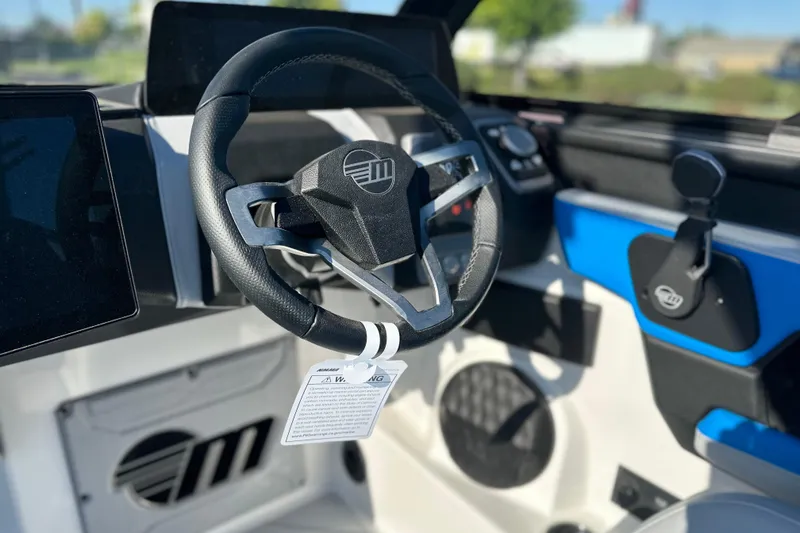 Slide: The Image of 2025 Malibu Wakesetter 23 LSV steering wheel and dashboard interior view. - 14