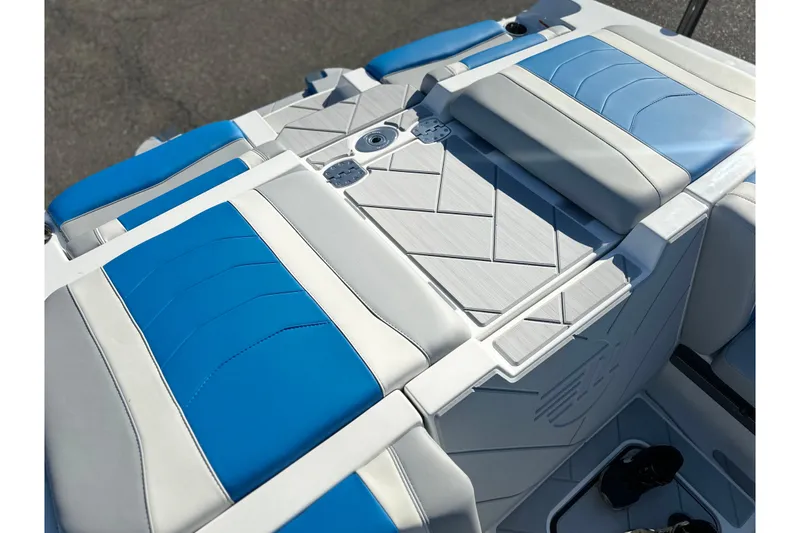 Slide: The Image of 2025 Malibu Wakesetter 23 LSV boat interior with blue and white seating. - 18