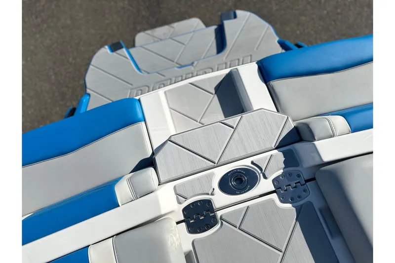 Slide: The Image of 2025 Malibu Wakesetter 23 LSV boat interior with blue and gray seating. - 20
