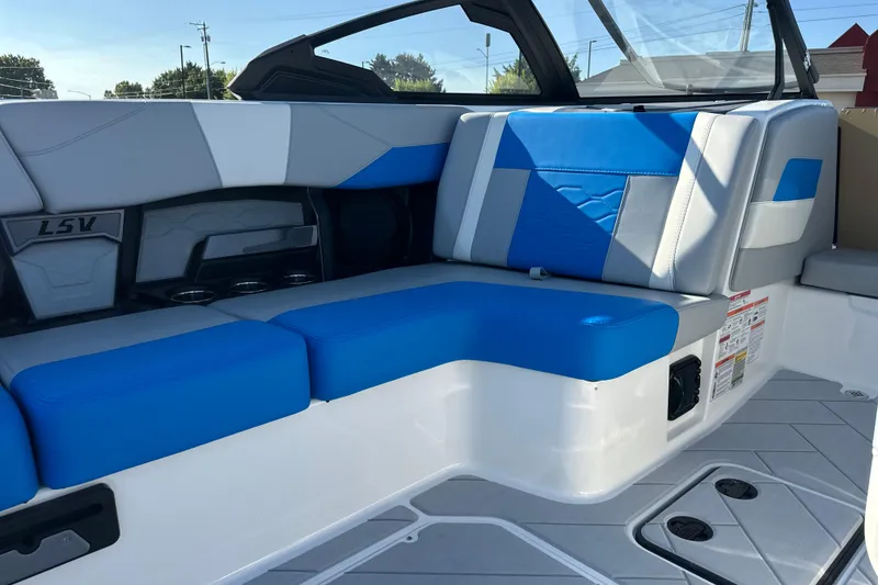 Slide: The Image of 2025 Malibu Wakesetter 23 LSV interior with blue and gray seating, showcasing modern design. - 9