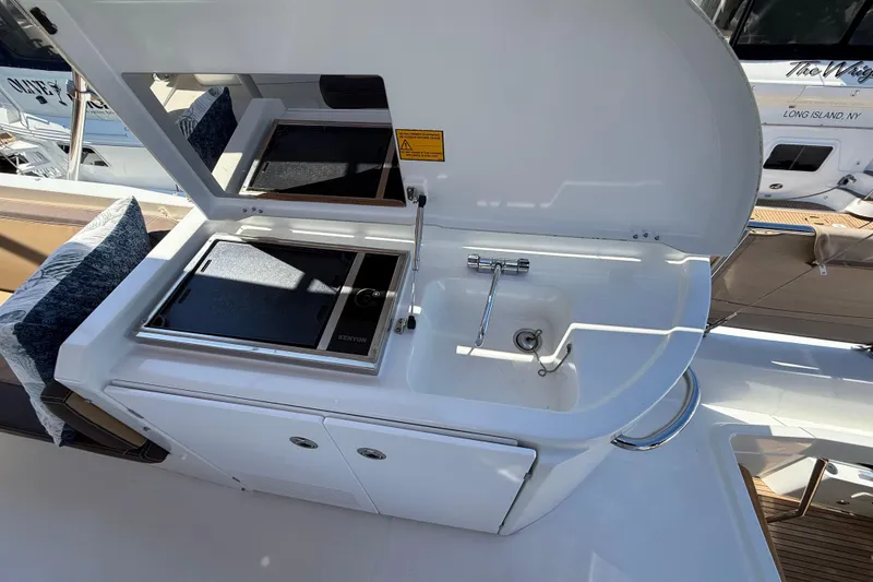 Slide: The Image of Outdoor kitchen on 2018 Beneteau Swift Trawler 44 with sink and grill. - 31