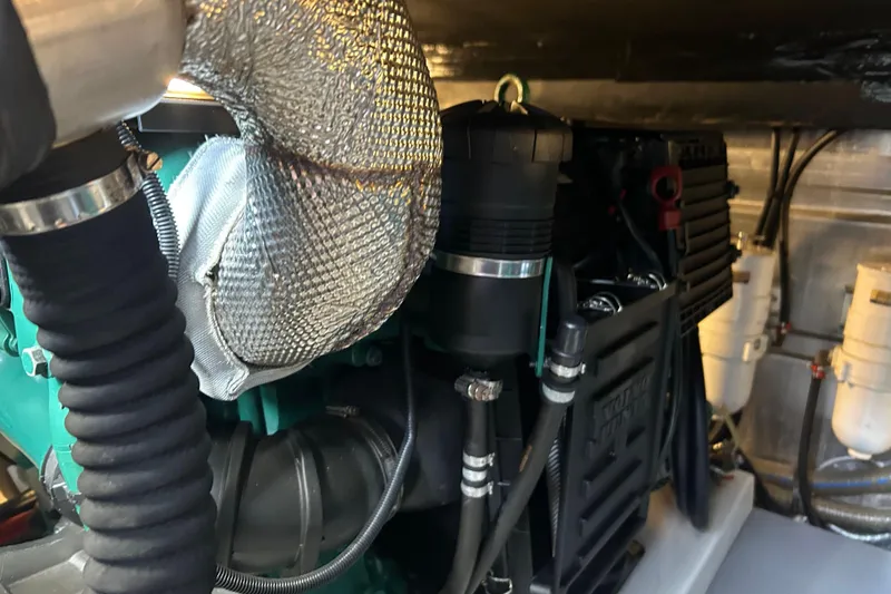 Slide: The Image of Engine room of 2018 Beneteau Swift Trawler 44 with visible components and wiring. - 36