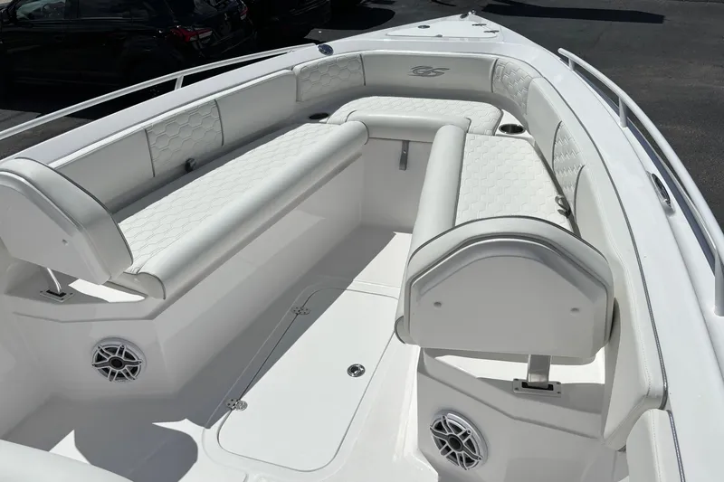 Slide: The Image of 2026 Glasstream 280 Pro-XS boat interior with white cushioned seating and speaker system. - 14